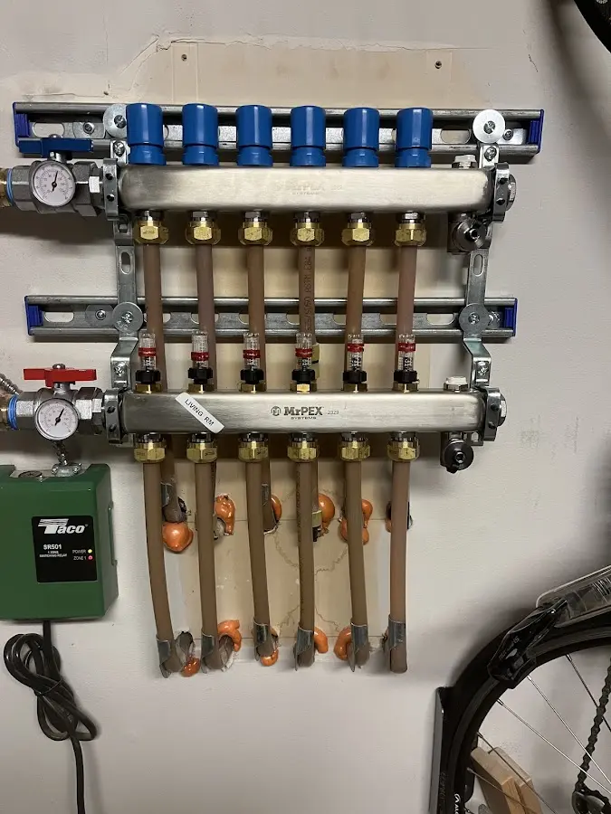 Plumber performing Water Heater Repair at a residential property in Godfrey